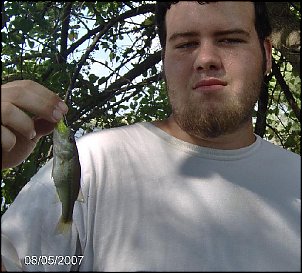 Click image for larger version

Name:	My Smallest Bass 8-5-07.JPG
Views:	335
Size:	57.5 KB
ID:	1781